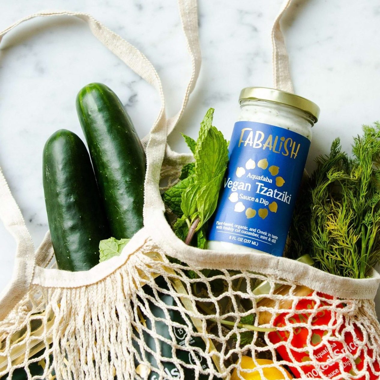 Mesh cloth tote bag with fresh produce, sustainable shopping